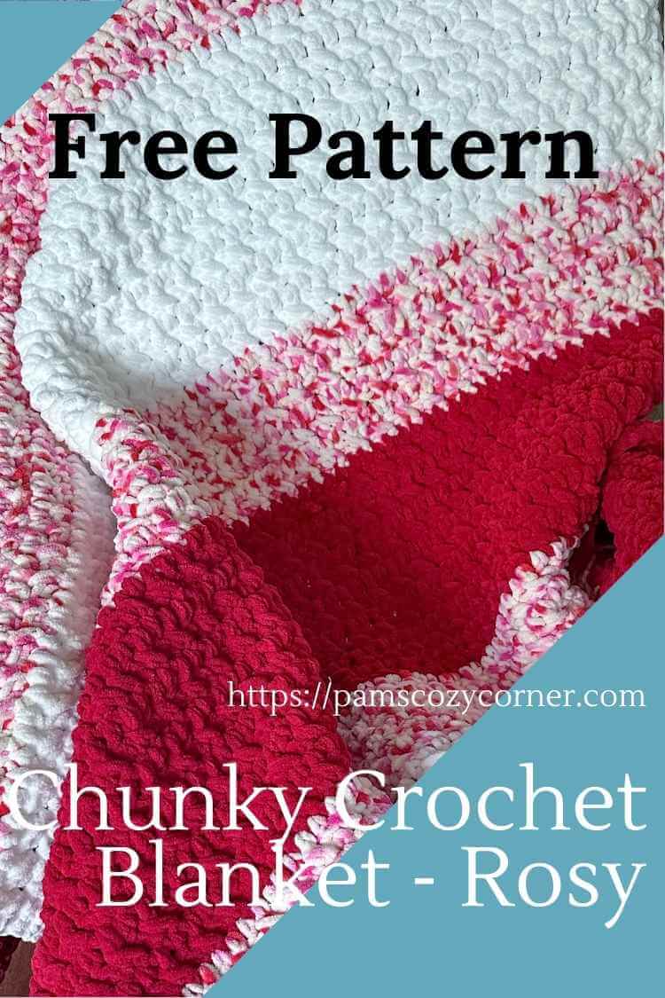 A white, red, and strawberry dot Bernat yarn blanket on a a chair