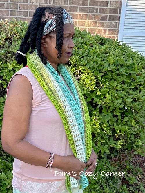 Handmade crochet lace scarf flat lay showing full length and texture