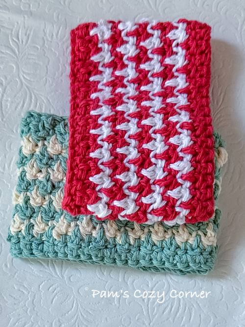 Easy Textured Crochet Cup Cozy Pattern 4 Handmade crochet coffee cup cozy in two coordinating cotton colors, showing the textured stitch pattern and snug fit around a hot drink.